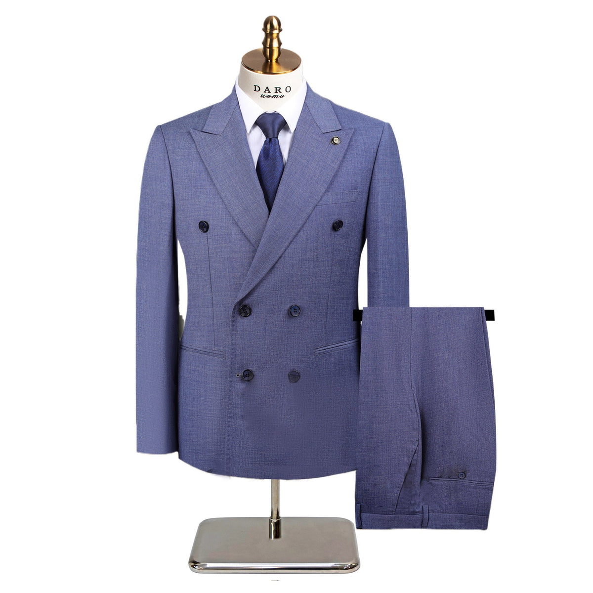 Full view of a men's green textured double-breasted suit with a yellow patterned tie, displayed on a mannequin, with matching