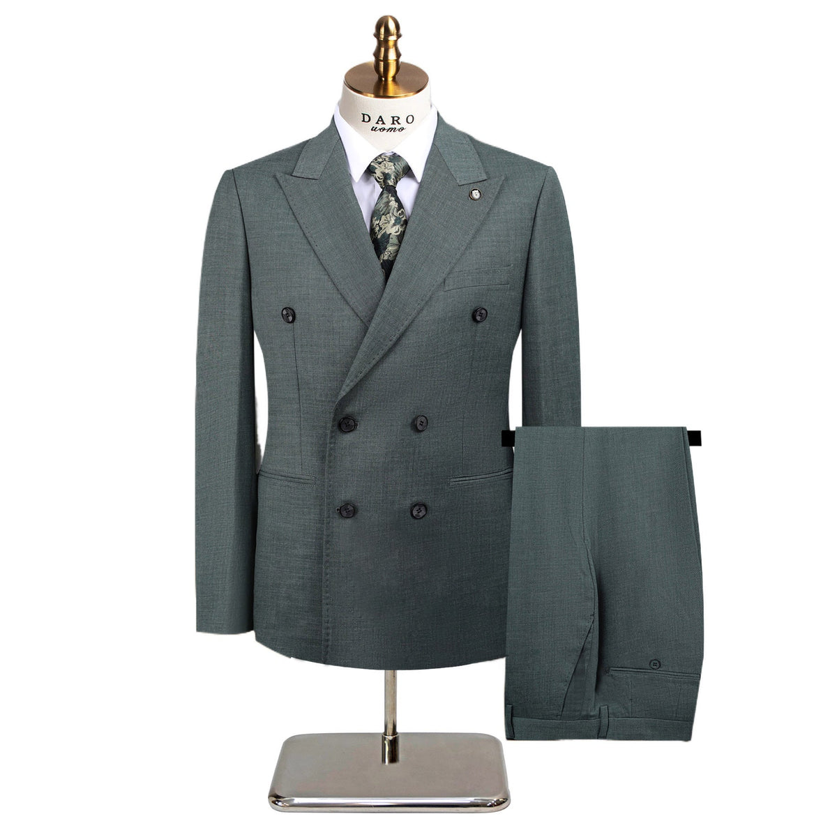 Full view of a men's green textured double-breasted suit with a yellow patterned tie, displayed on a mannequin, with matching