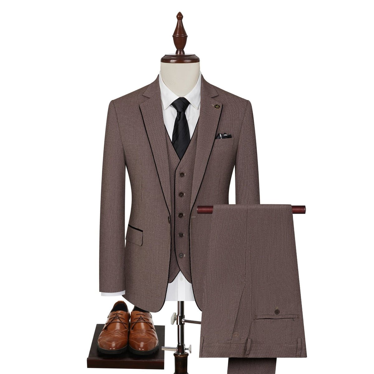 Men's brown three-piece suit with black contrast trim, including a jacket, vest, and trousers, displayed on a mannequin.