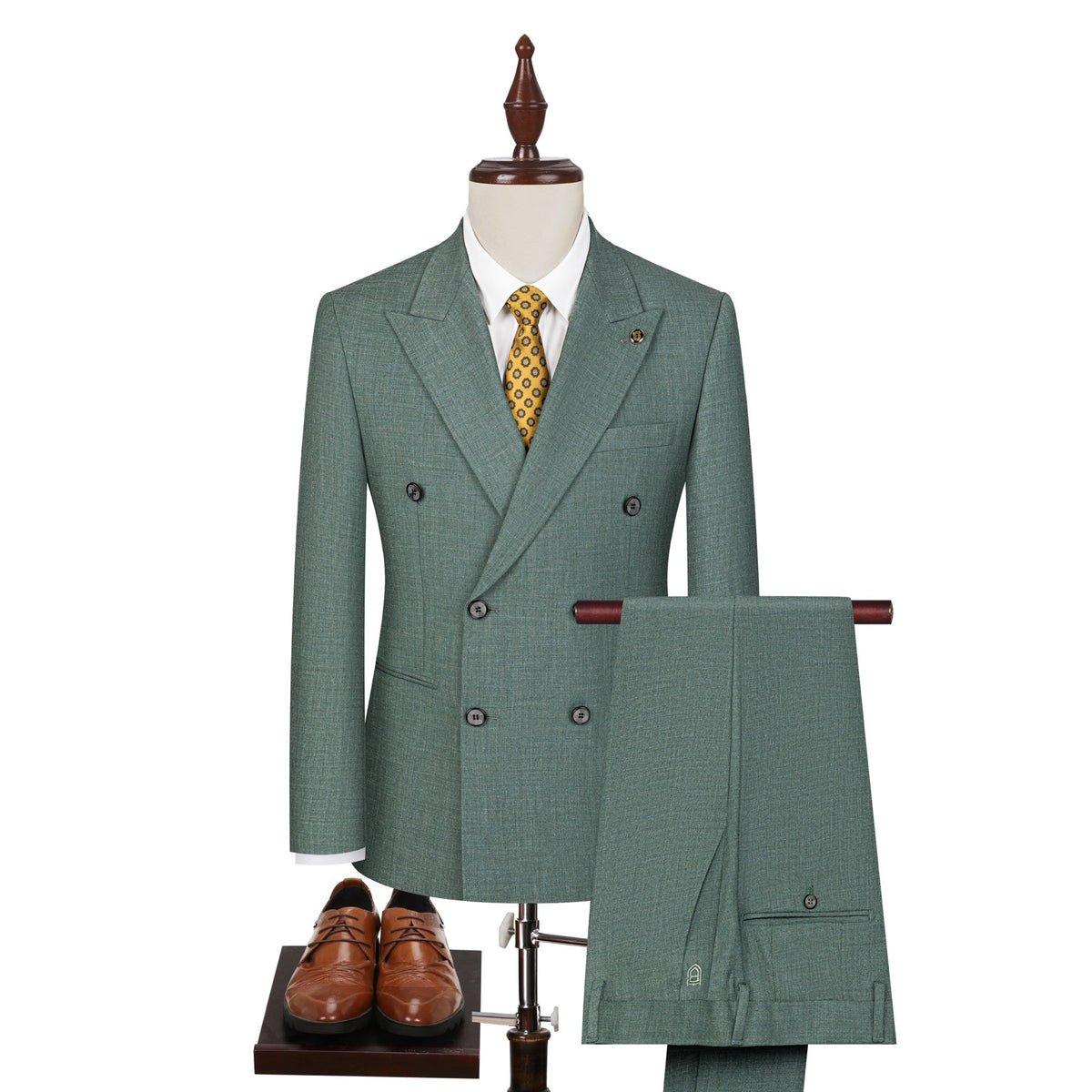 Full view of a men's green textured double-breasted suit with a yellow patterned tie, displayed on a mannequin, with matching