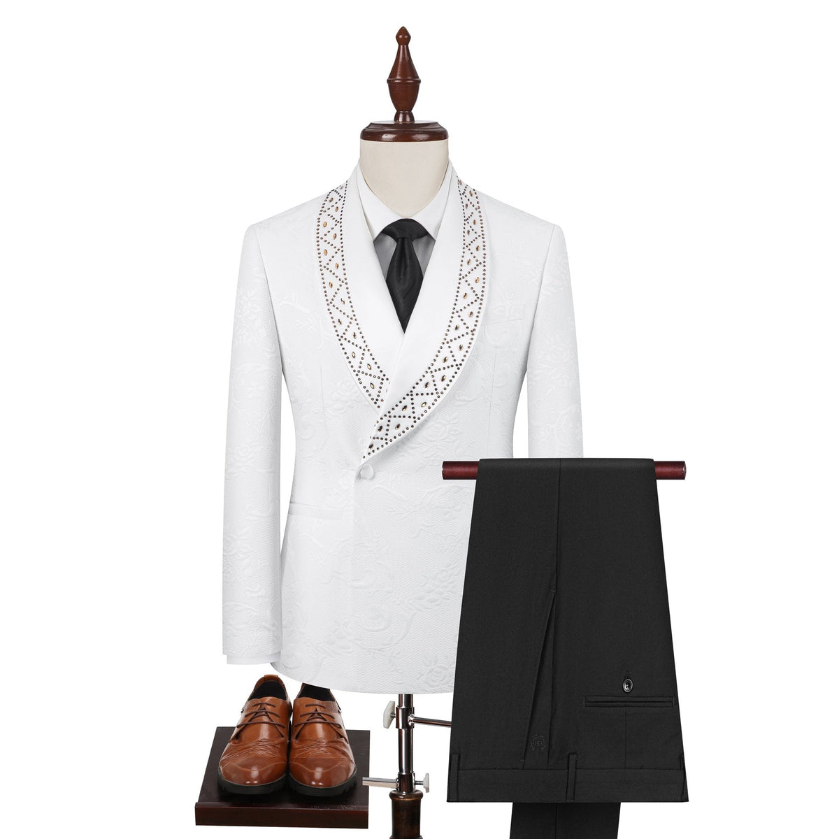 Full view of a men's white jacquard double-breasted suit with studded shawl lapels, paired with black trousers and brown