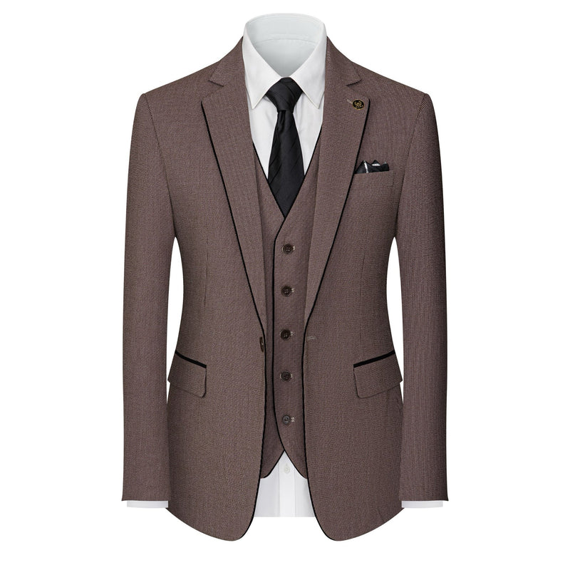 Men's brown three-piece suit with black contrast trim, including a jacket, vest, and trousers, displayed on a mannequin.