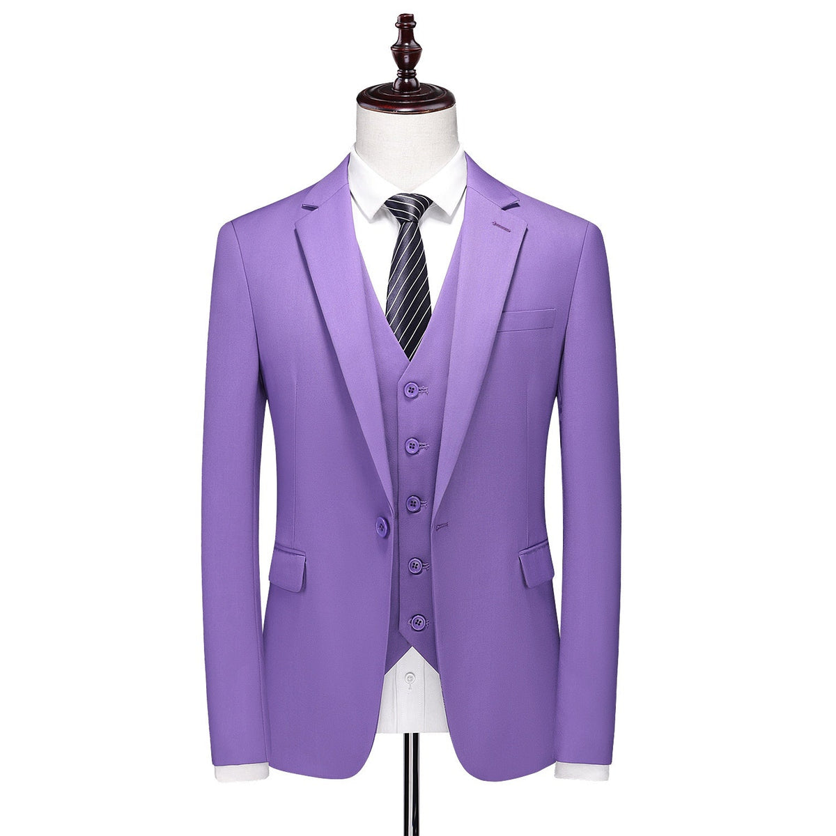 Men's purple three-piece suit, including a blazer, vest, and trousers, displayed on a mannequin with a white shirt and