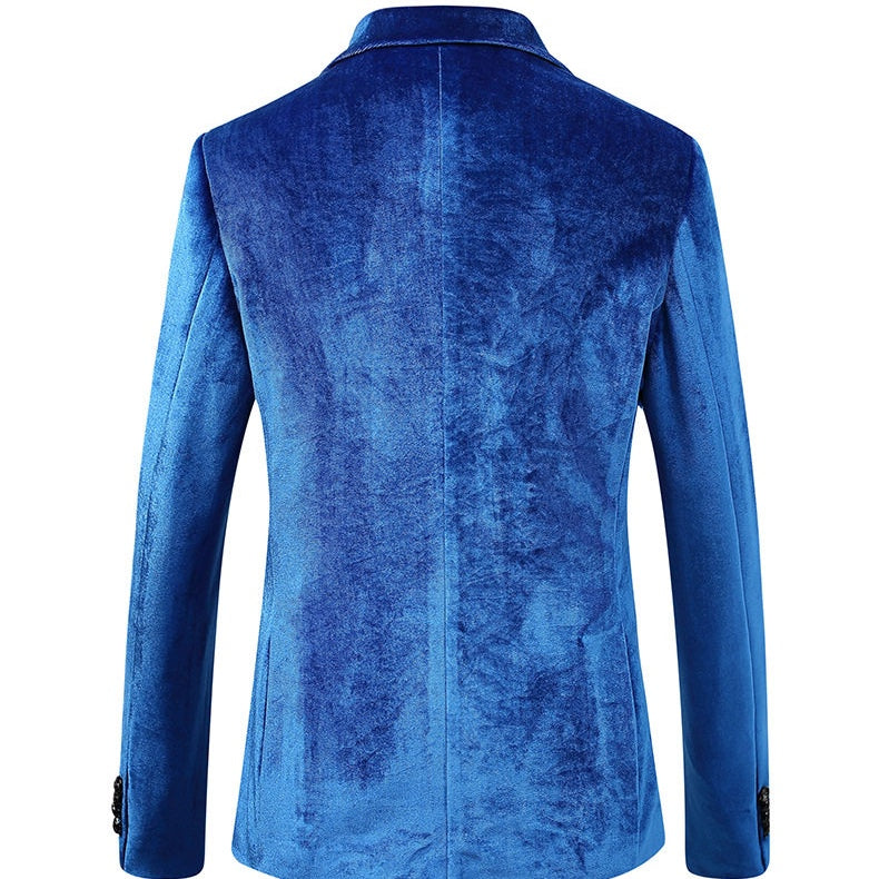 A collection of men's velvet suits in blue, red, gold, purple, and green, each featuring a one-button blazer with a feather