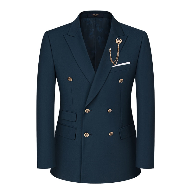Front view of a men's dark blue double-breasted suit with a yellow patterned tie and a gold chain lapel pin on a mannequin.