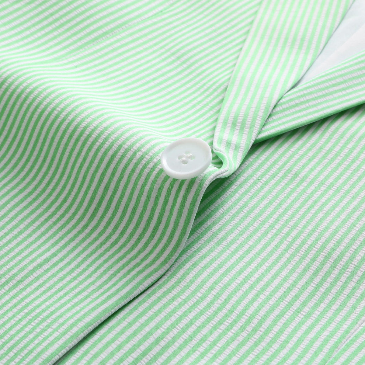 Front view of a men's light green and white striped seersucker suit, including a single-breasted blazer and matching