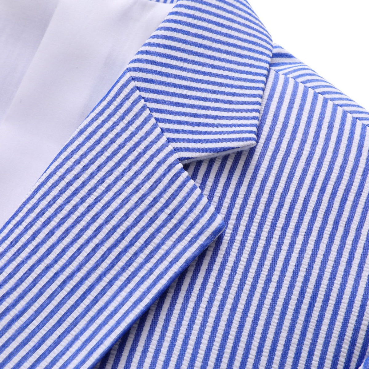 Front view of a men's blue and white pinstripe two-piece suit, including a single-breasted blazer and matching trousers.