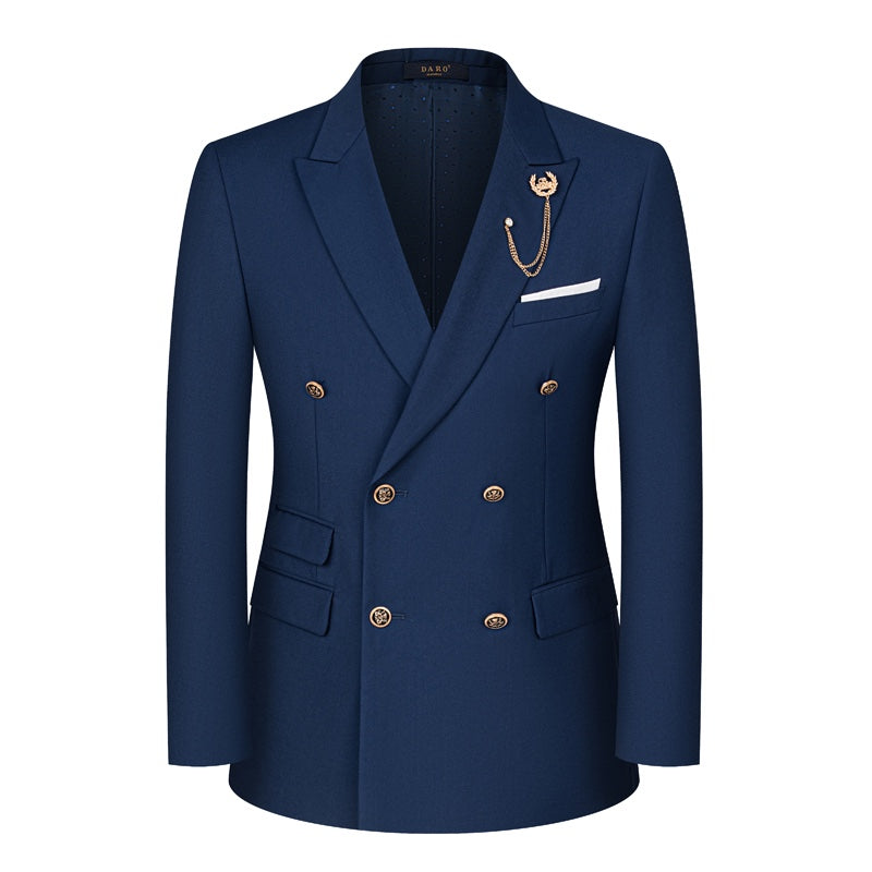 A men's navy blue double-breasted suit with gold buttons, peaked lapels, and a decorative gold chain lapel pin, displayed on