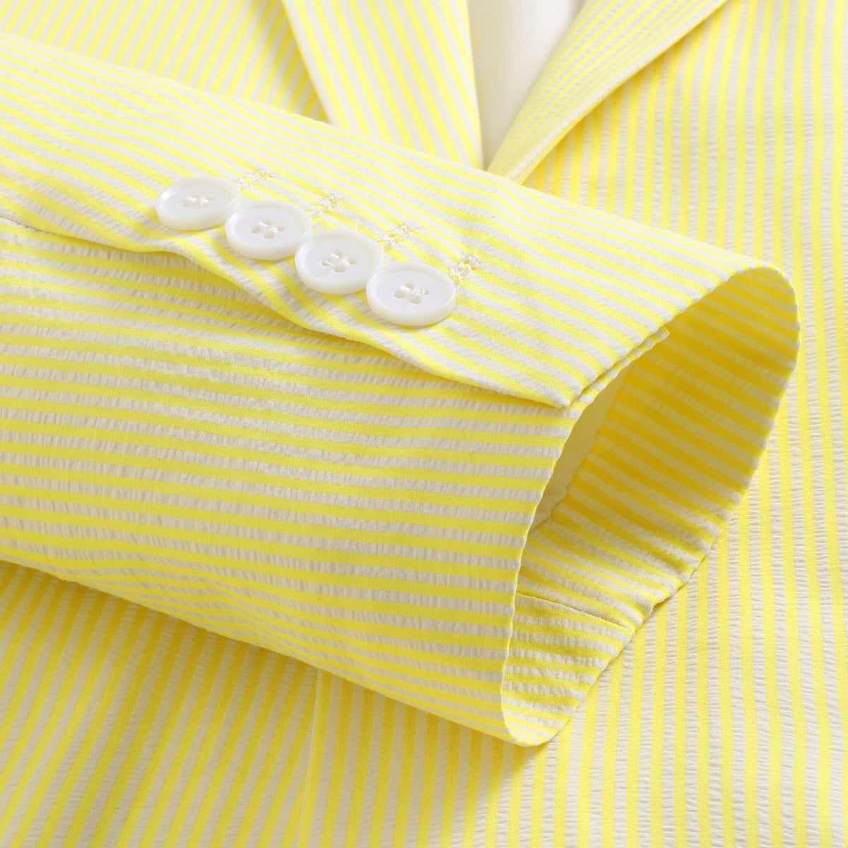 Front view of a men's yellow and white striped seersucker two-piece suit with a single-breasted jacket, notched lapels, and