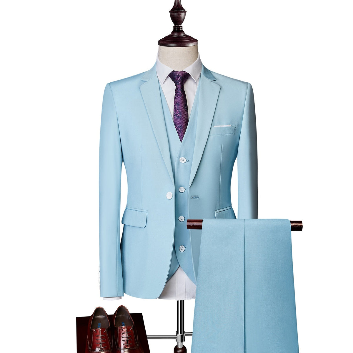 A collection of men's slim fit 3 piece suits in various colors, including blue, pink, white, red, and more, displayed on