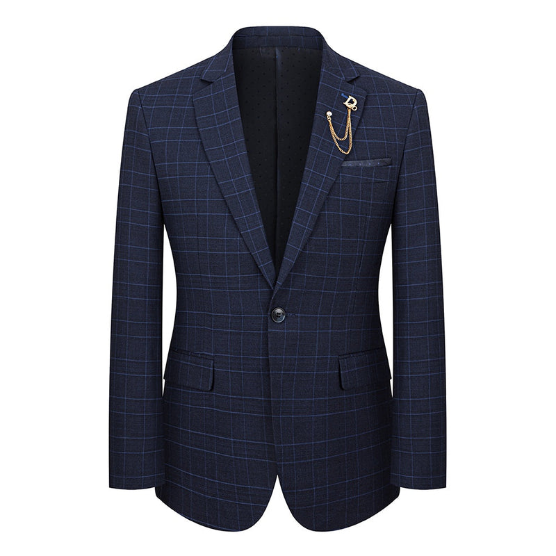 Close-up of a men's navy blue plaid 3-piece suit jacket with a gold chain lapel pin, vest, and trousers.