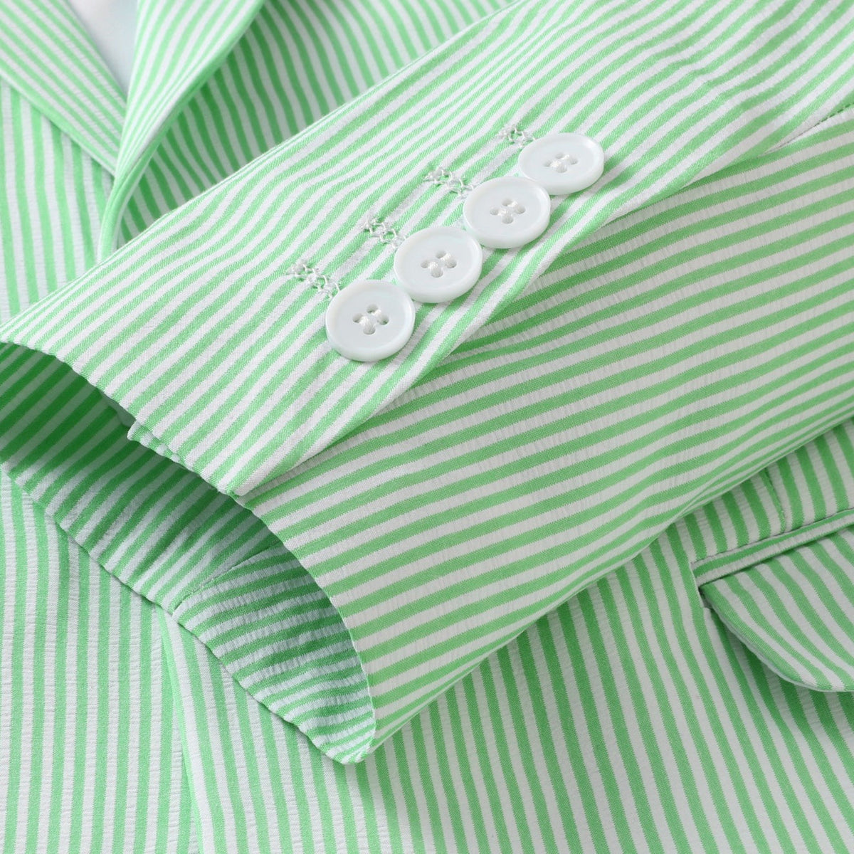 Front view of a men's light green and white striped seersucker suit, including a single-breasted blazer and matching
