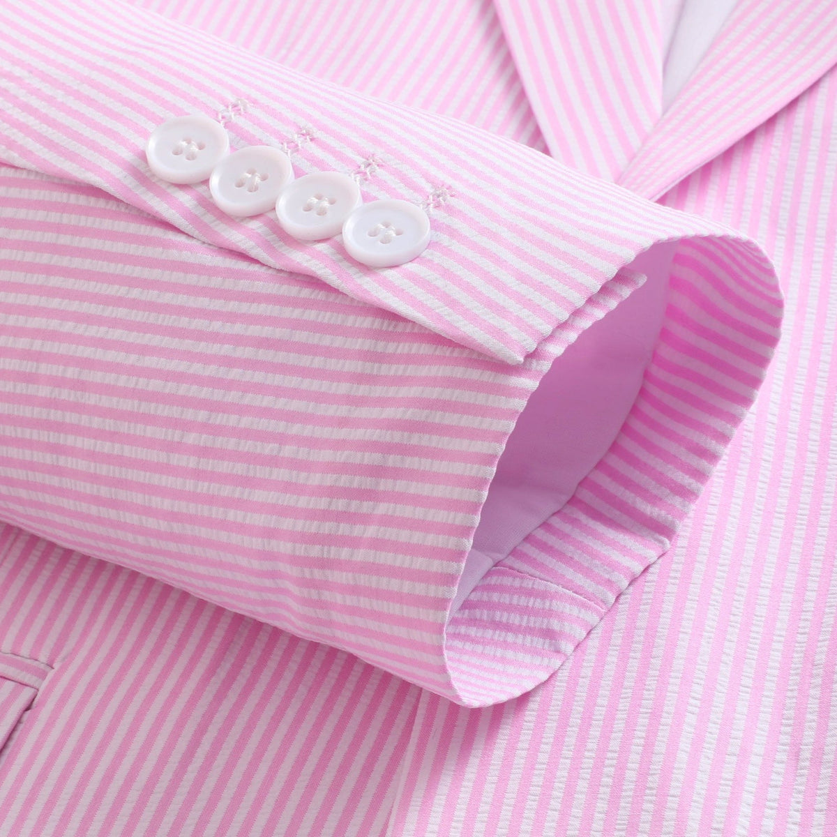 Front view of a men's two-piece pink and white striped seersucker suit with a single-breasted jacket and matching trousers.