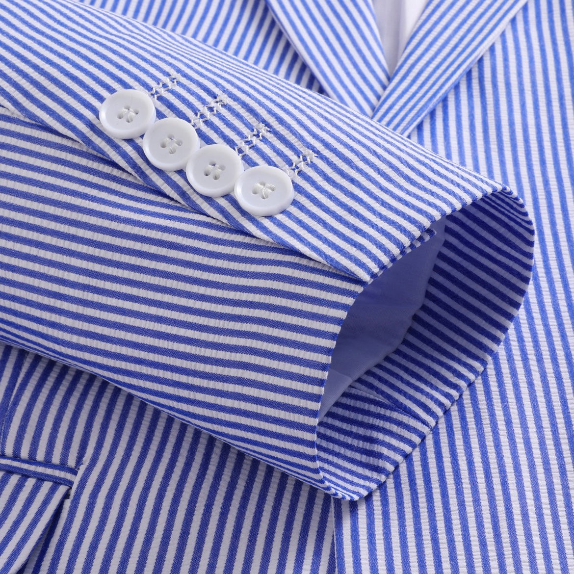 Front view of a men's blue and white pinstripe two-piece suit, including a single-breasted blazer and matching trousers.