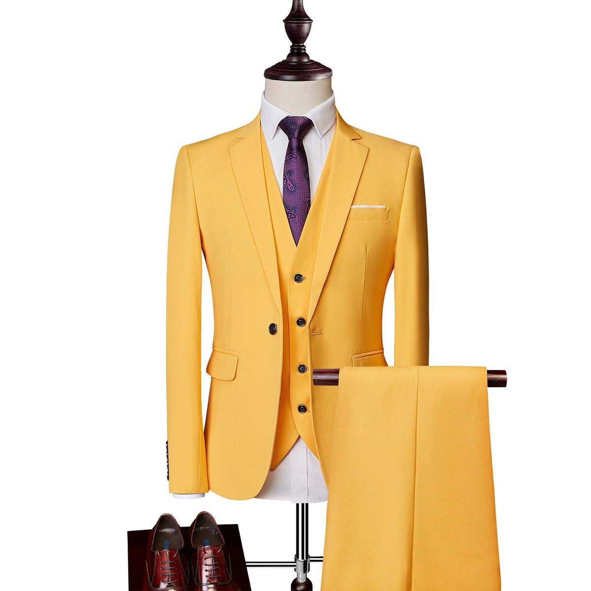 A collection of men's slim fit 3 piece suits in various colors, including blue, pink, white, red, and more, displayed on