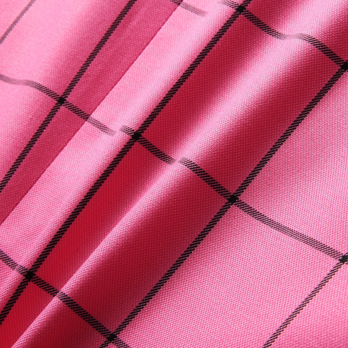 Front view of a men's bright pink plaid blazer and matching shorts set.