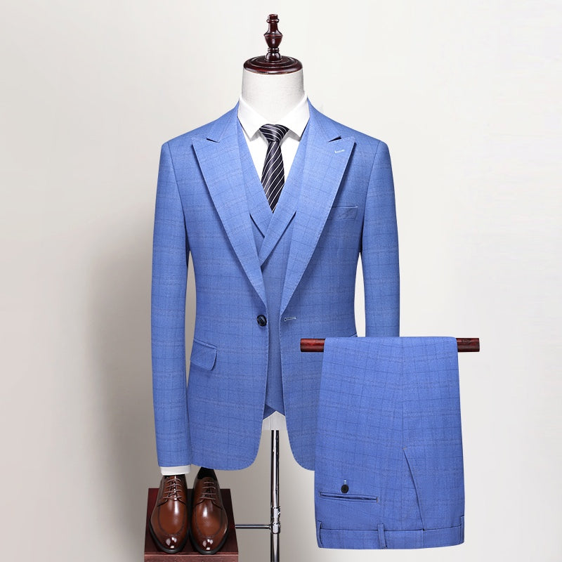 Full view of a men's blue plaid three-piece suit including jacket, double-breasted vest, and trousers, styled on a mannequin.