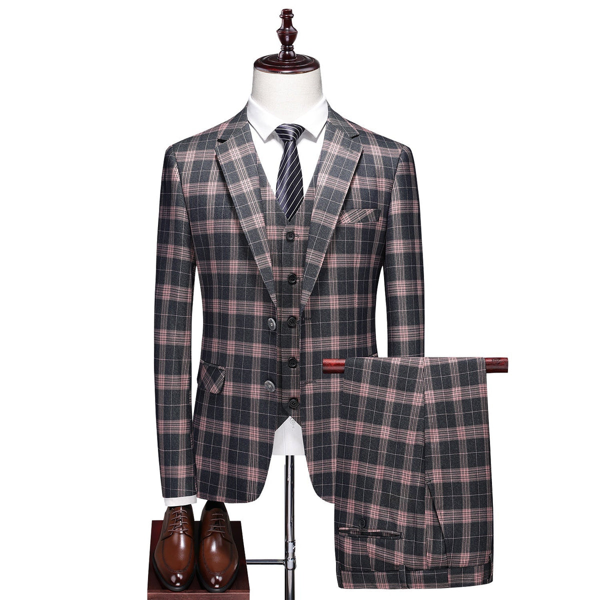 Front view of a men's dark gray and pink plaid three-piece suit, including blazer, vest, and trousers.